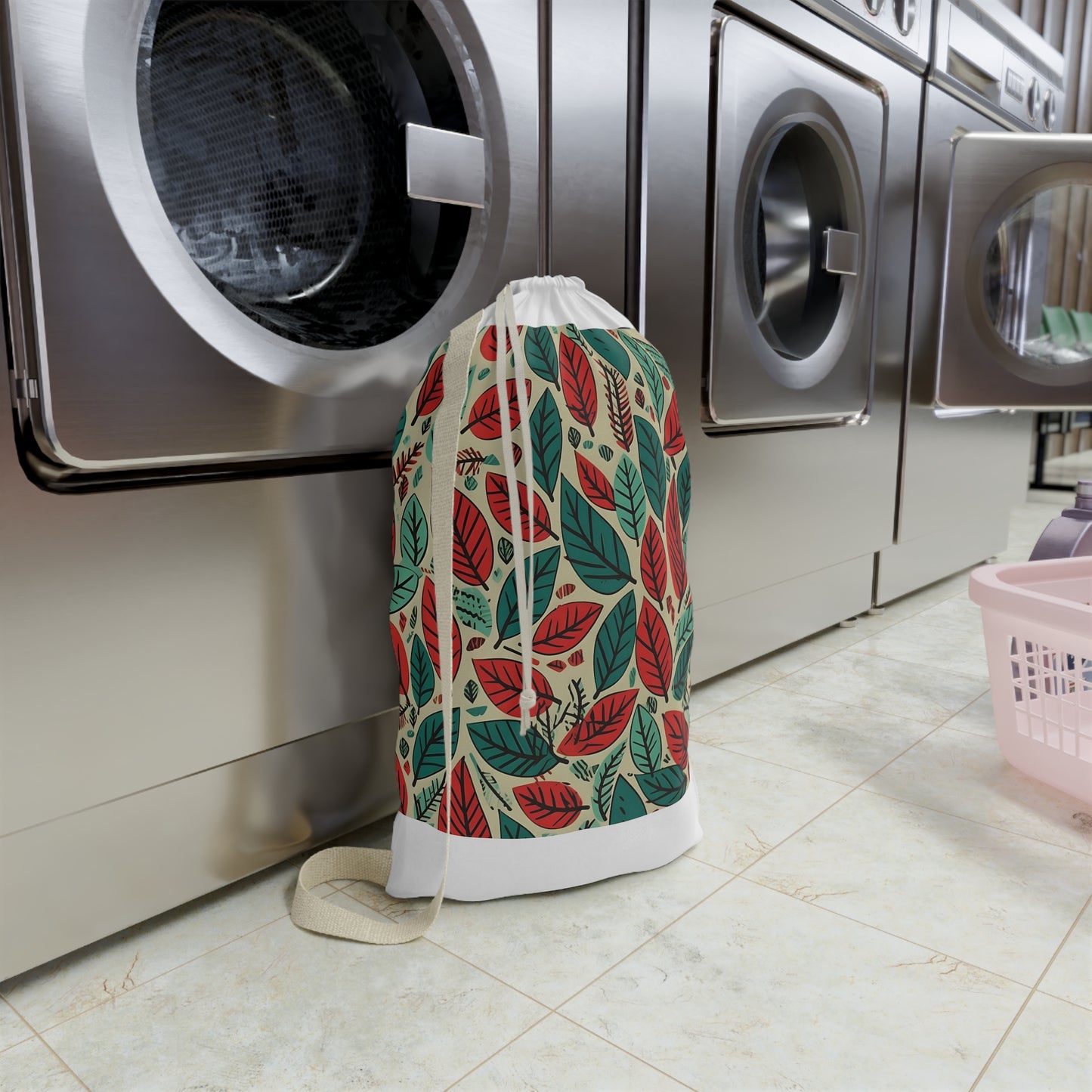 Leaf pattern laundry bag in modern green and red design. Soft, durable fabric for stylish laundry transport.