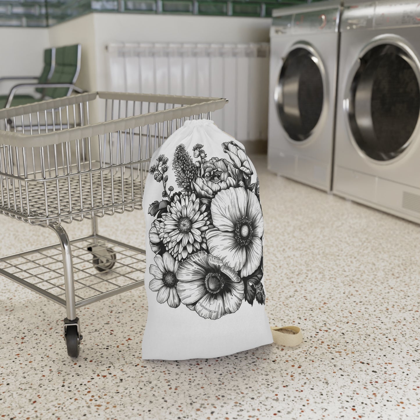 "Hand-drawn floral laundry bag for chic organization on laundry day"