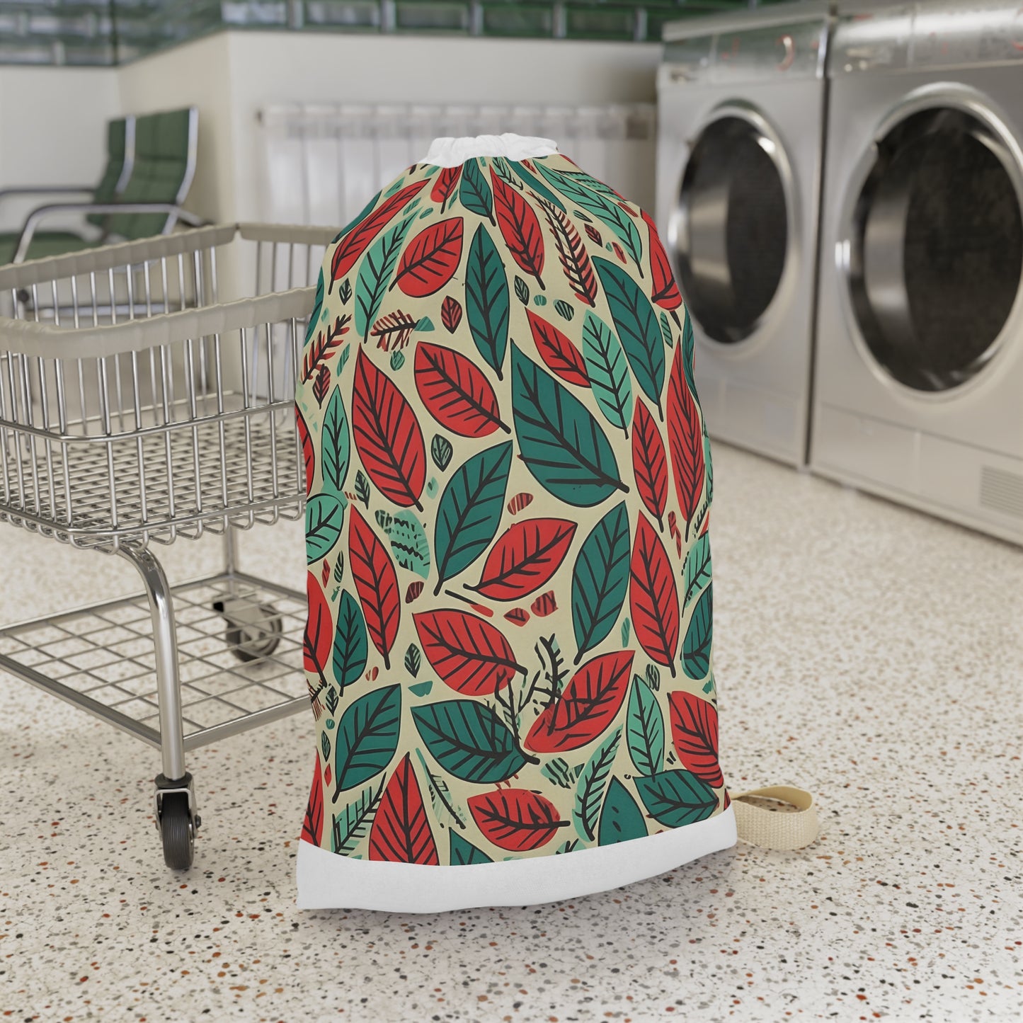 "Green and red leaf pattern laundry bag for stylish transport of dirty clothes"