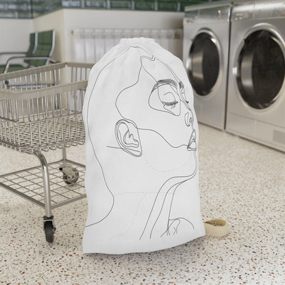 "Minimalist face sketch laundry bag for stylish laundry organization"