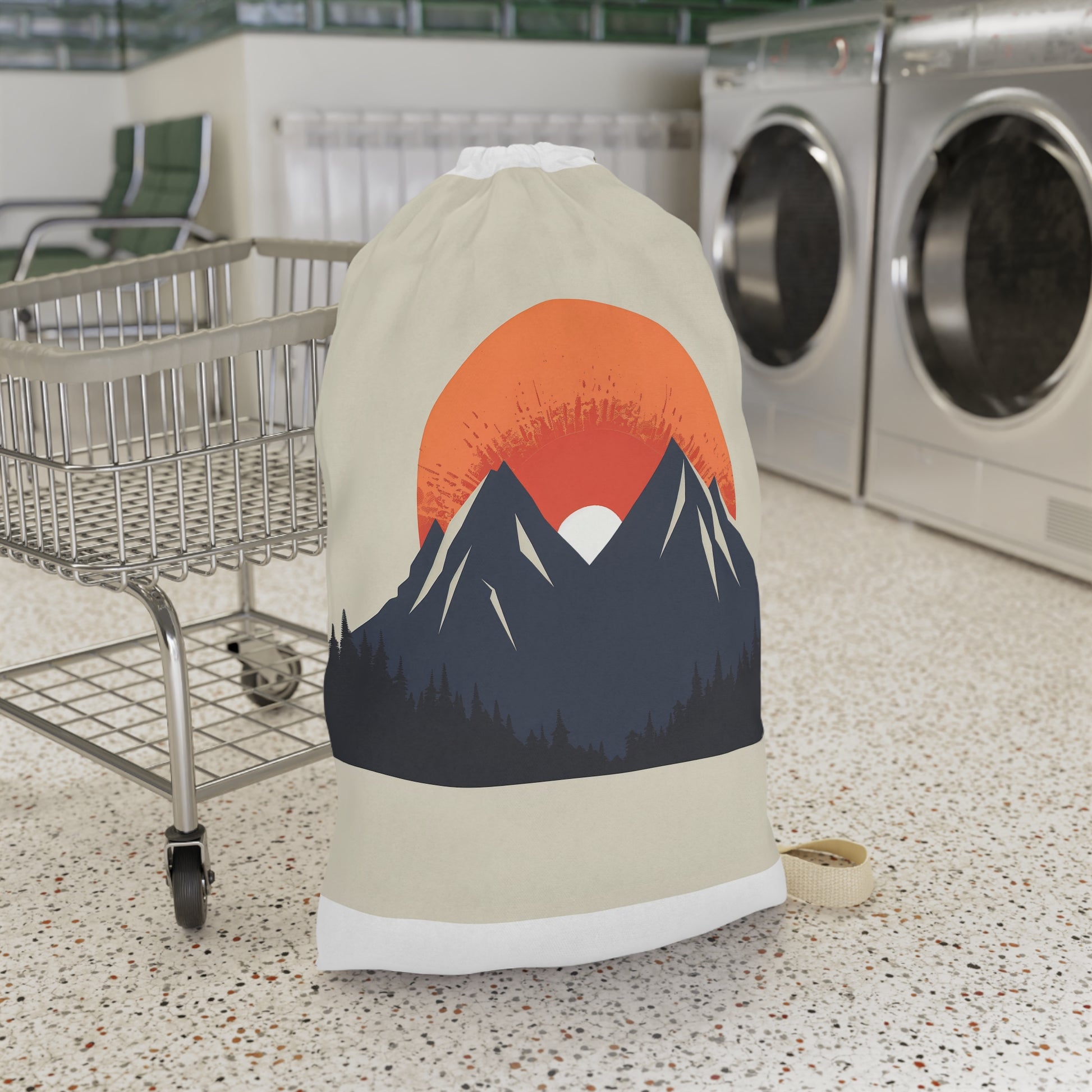 "Sunrise Mountain Laundry Bag - Minimalist design with rising sun over peaks, elevate your laundry routine in style"