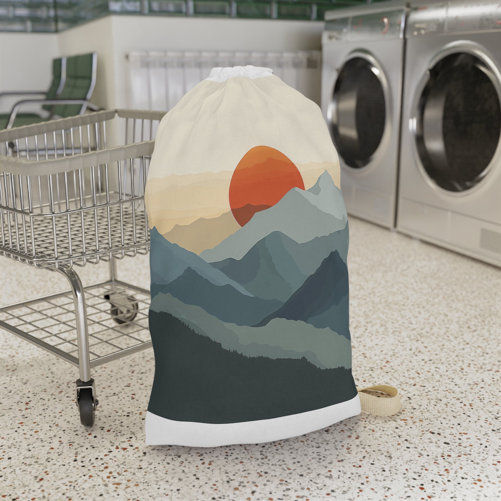 "Sunrise Mountain Laundry Bag - minimalist design with rising sun, keeps clothes organized in style"