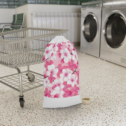 "Cherry blossom laundry bag with pink and white floral pattern for stylish laundry routine"