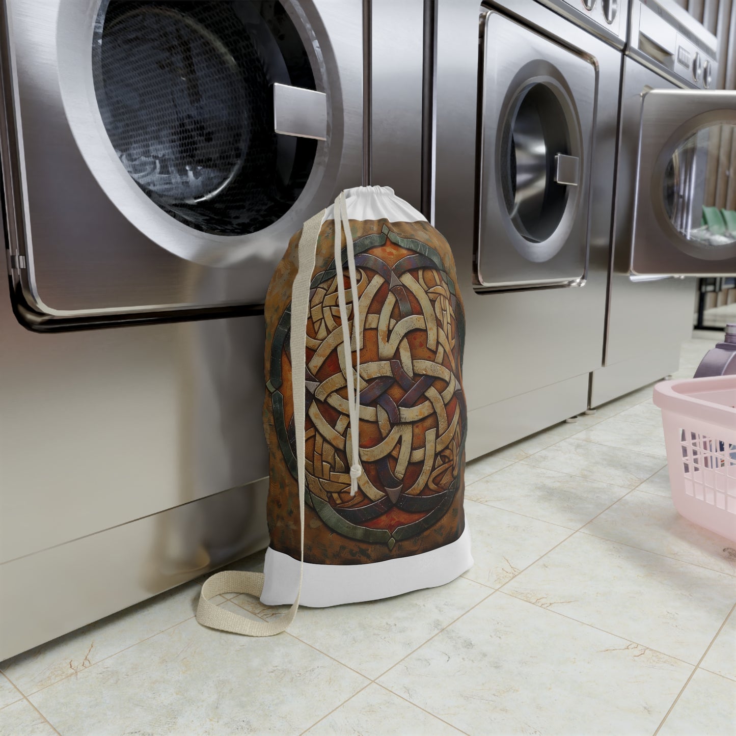 Stylish Celtic knot design laundry bag with drawstring closure for organized laundry transport.