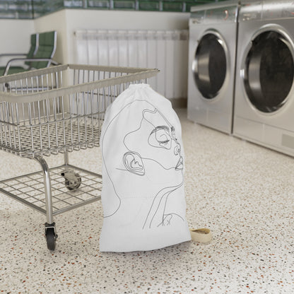 "Stylish Face Sketch Laundry Bag - Minimalist line art design for organized laundry routine"