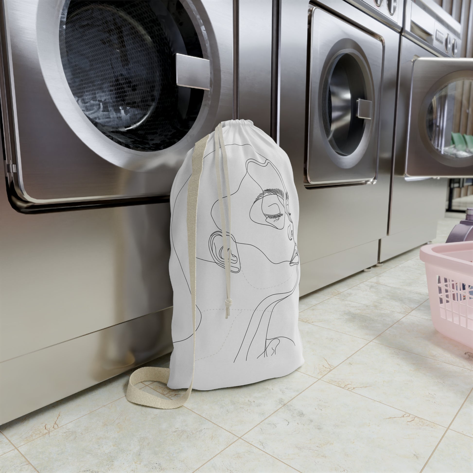 "Minimalist line art face laundry bag for stylish and organized laundry routines"