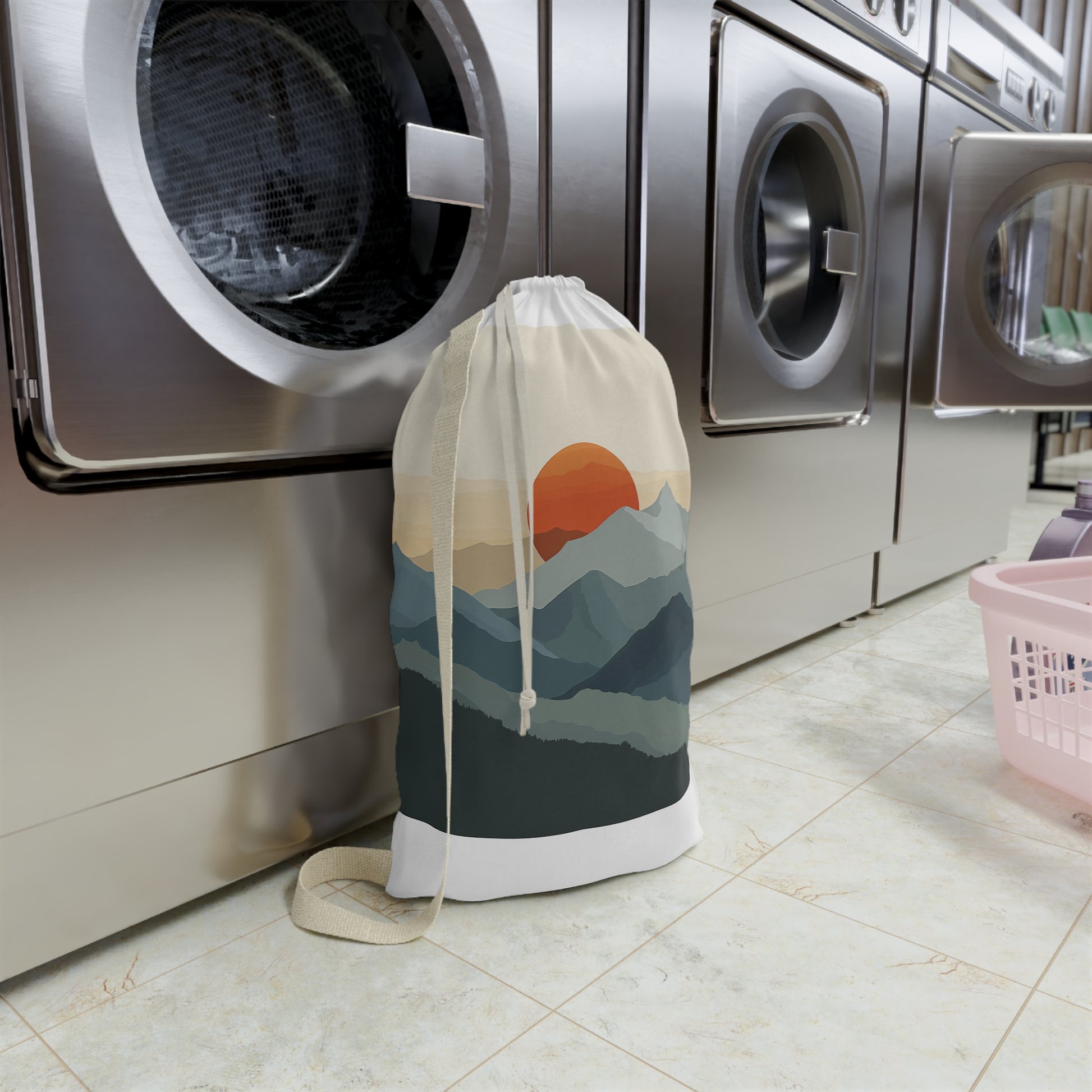 "Sunrise Mountain laundry bag with rising sun design, organize clothes in style"