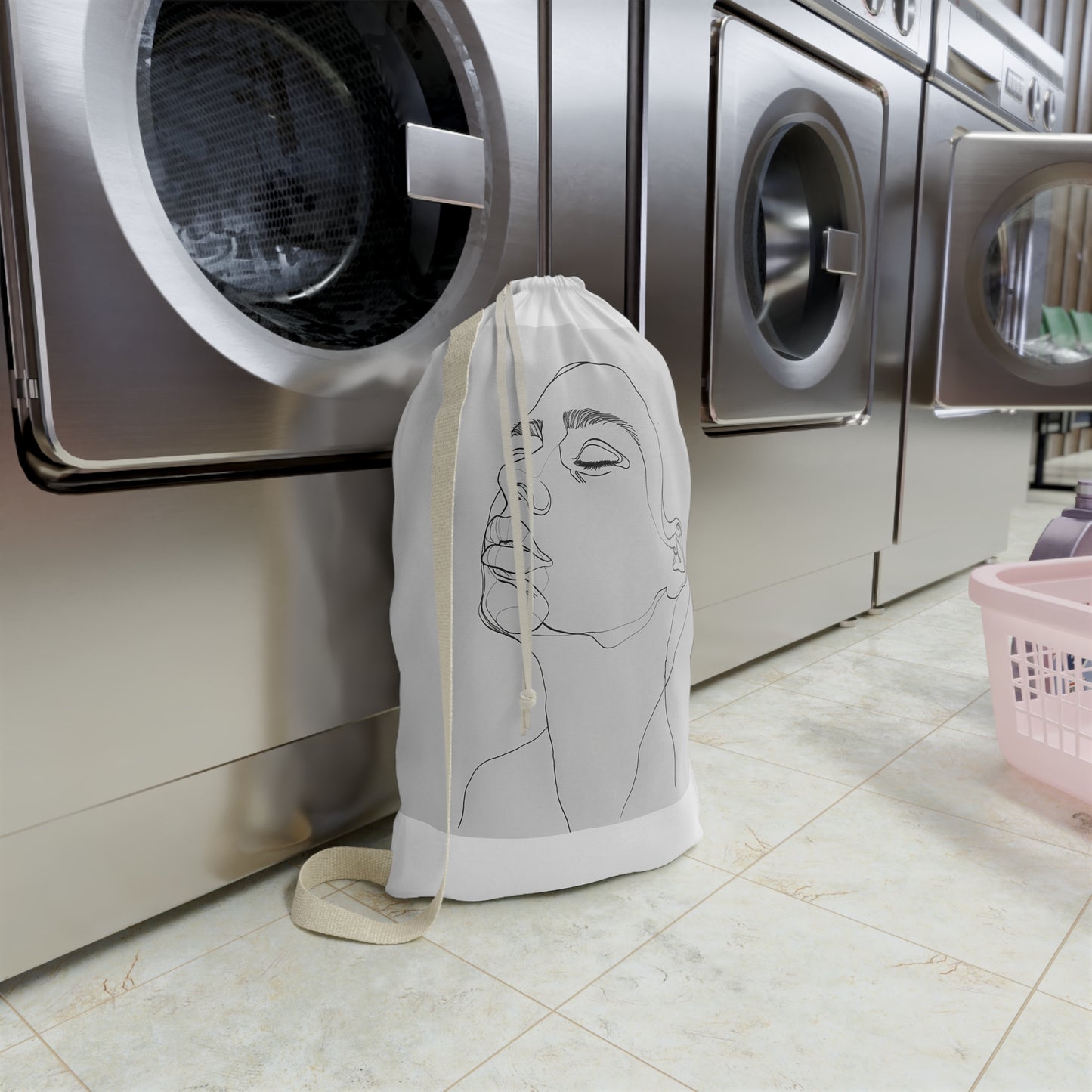 "Chic Minimalist Face Laundry Bag - Durable and Stylish Laundry Essential for Modern Homes"