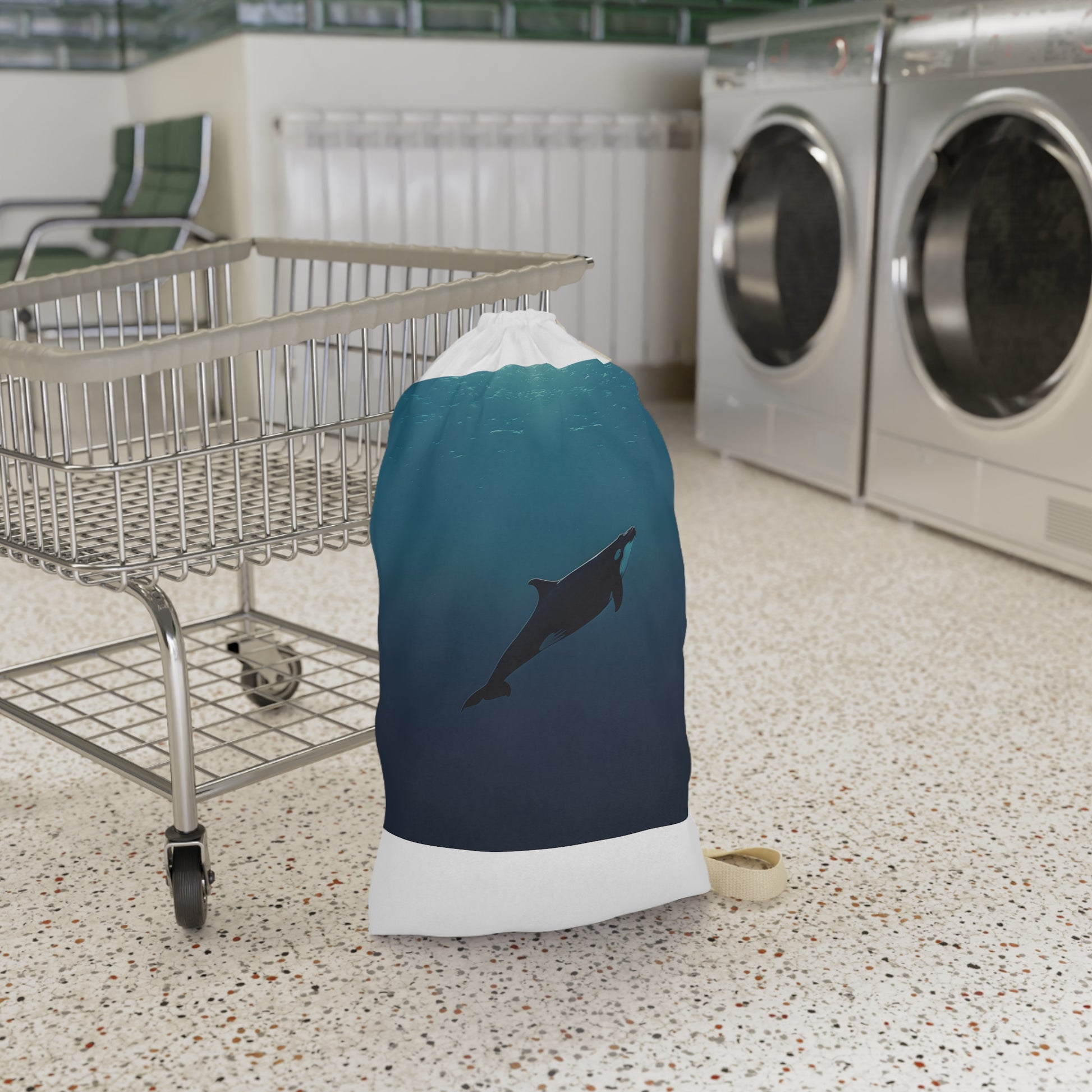 "Whale Ocean Laundry Bag: Stylish minimalist design with whale swimming in the ocean, perfect for elevating your laundry routine."