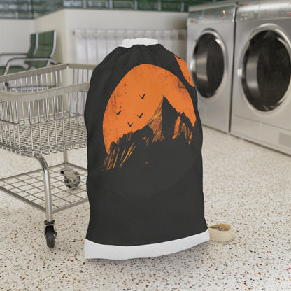 "Sunrise mountain range laundry bag with rising sun design for stylish organization"