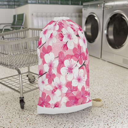 "Cherry Blossom Laundry Bag - Elegant pink and white patterned bag for stylish laundry carrying"