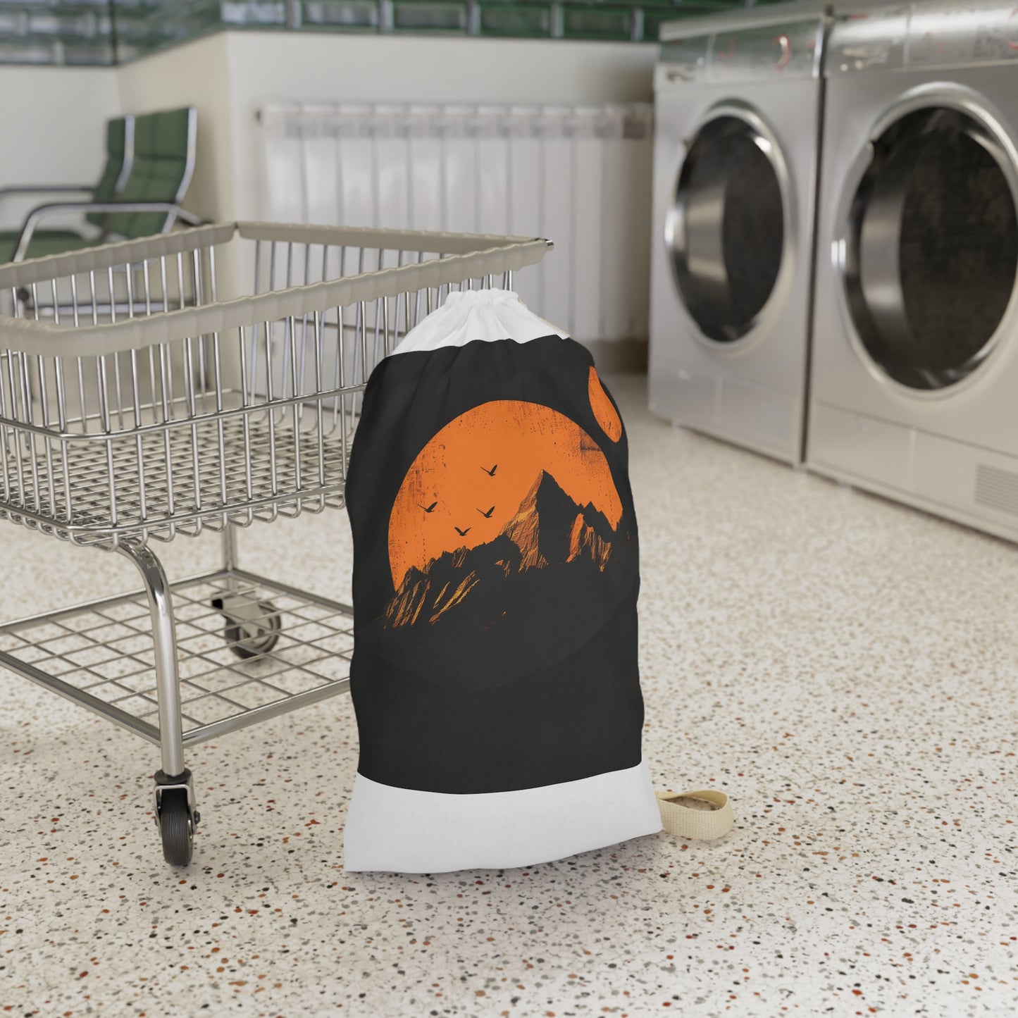 "Sunrise Mountain Range Laundry Bag - Stylish laundry essential with minimalist design and rising sun motif, perfect for organization."