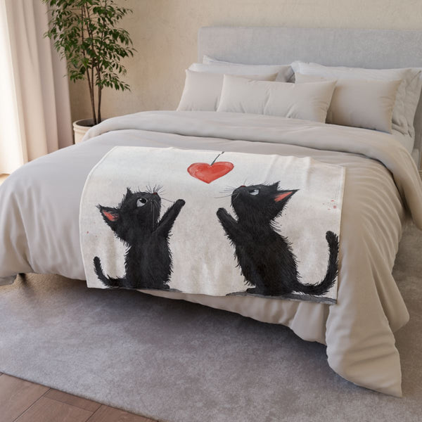 Shailea Two Very Cute Black Cats Trying to Catch a Hanging Hear — Plush Fleece Throw Blanket — Drape over Sofa & Bed Lifestyle View