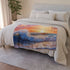 Sunset Through Rolling Wave Beach — 50×60 Plush Throw Blanket — Draped Over Sofa & Bed Lifestyle View